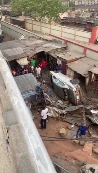 Car falls off the bridge in Lagos